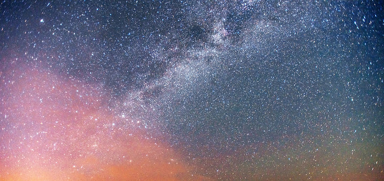 Vibrant night sky, filled with billions of stars and the Milky Way.