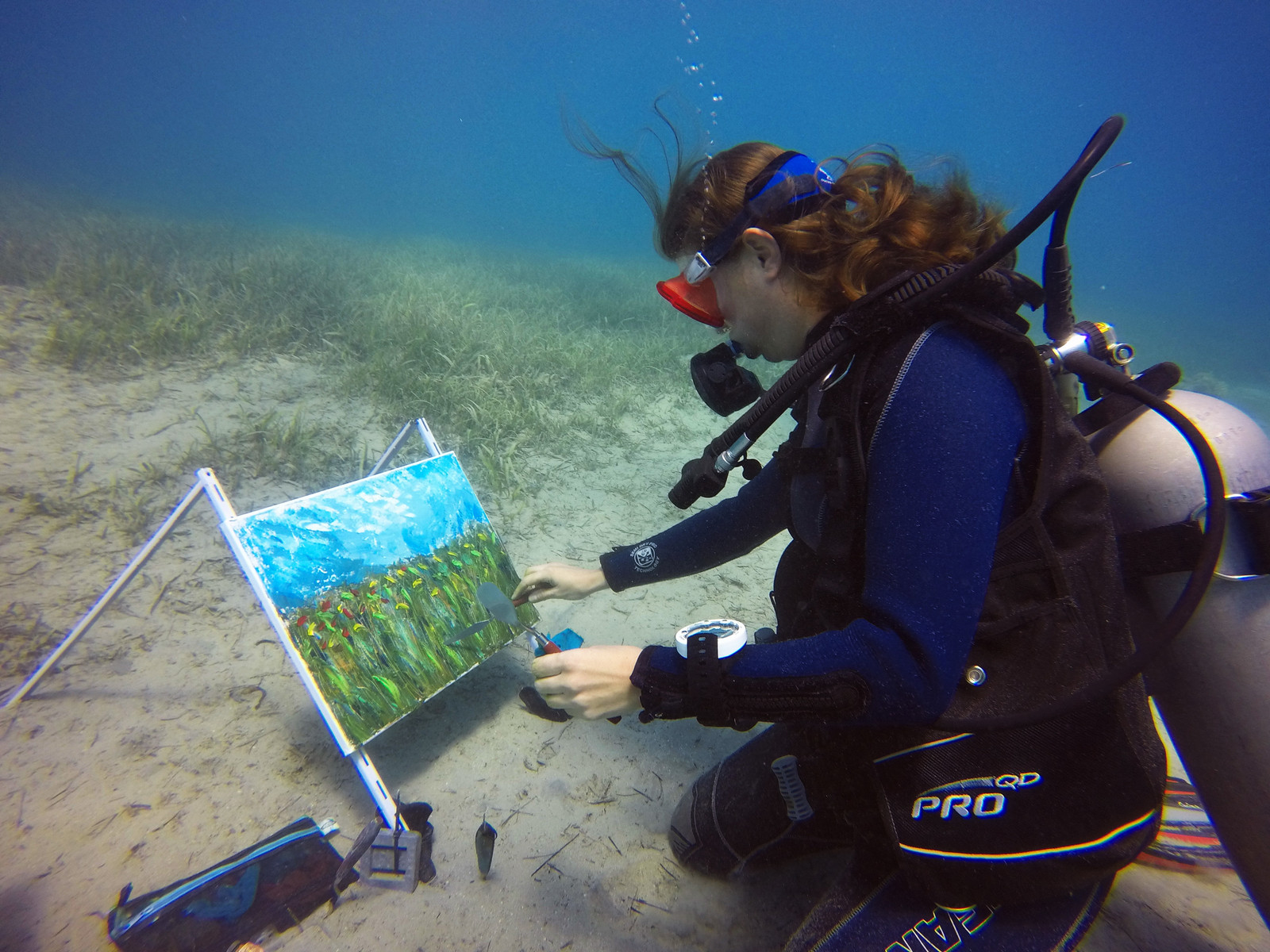 Student creates her artwork from life nature underwater.