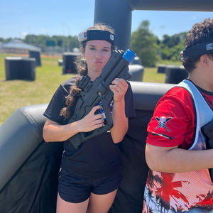 Girl prepared for outdoor laser tag battle