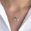Thumbnail: Flower and Bud Pendant close up on neck