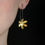Thumbnail: Flower Drop Earrings, Oxidised Silver and 22ct Gold Leaf on Ear