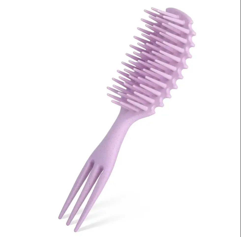 Eye-level view of a detangling brush on a wooden surface