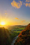 Landscape photography of a sunlit coastal path in North Devon during golden hour, showcasing professional commercial photography by JonnyWattUK.