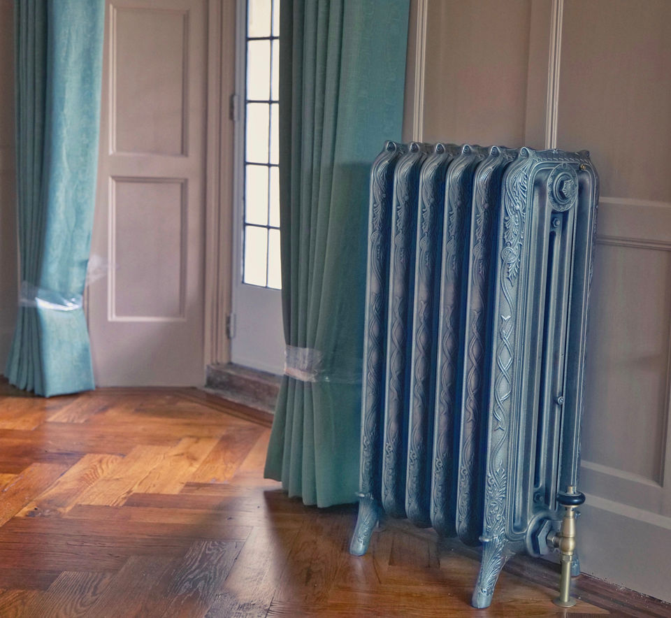Elegant cast iron radiator in a classic room