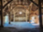 Spacious timber-framed barn interior, ample light