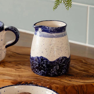 Mediterranean soul: The 'Wave' range features hand-painted ceramics that capture the fluid beauty of