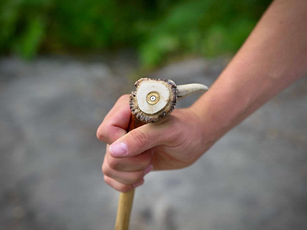 Artisan Crafted Walking Canes with an authentic antler handle being held outdoors by Treeless Group