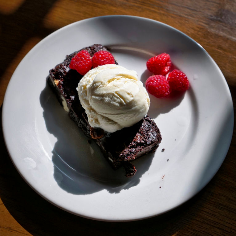 Warm Chocolate Brownie  served with Vanilla Ice-Cream and fresh Raspberries by JonnyWattUK