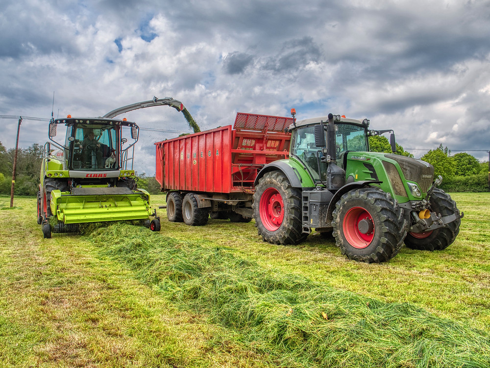 Forage Harvester unloading into a tractor and trailer.