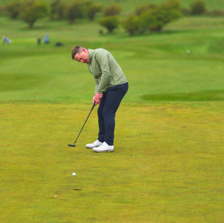 Putting Action and concentration at the 10th Green.