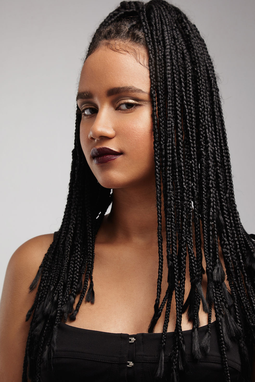 serious-black-woman-with-braids.jpg