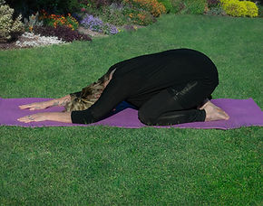 Pamela Grosam holding a Yin Yoga shape childs pose