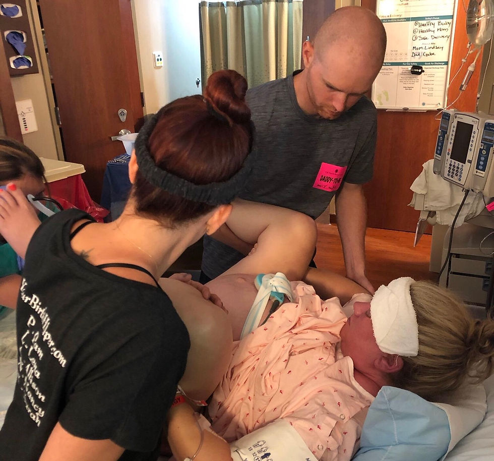 Midwife Natosha Croy, student midwife of Frontier Nursing University assists with perineal massage