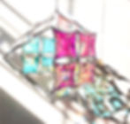 Close-up view of dichroic glass reflecting vibrant colors