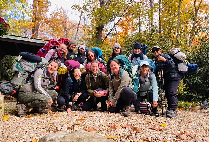 Backpacking group photo in fall forest—CNIT public program for mental health and nature connection