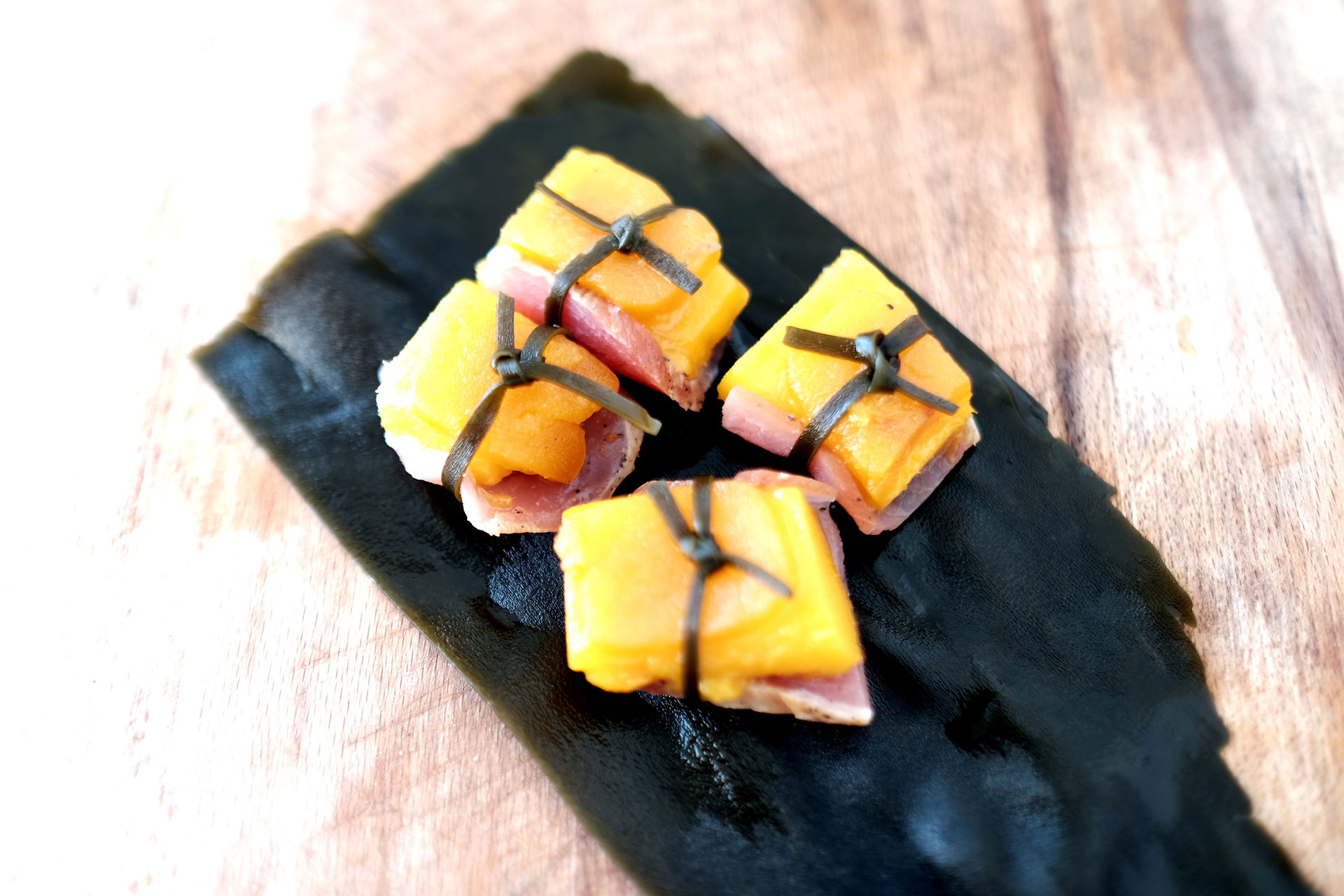 a dish by Chef vassilis alexiou with Botarga mango bellota kombu