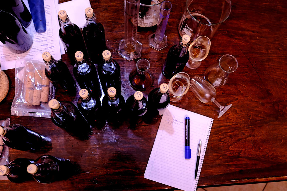 Winemaker's tasting notes alongside sample bottles at Philia Winery, Samos