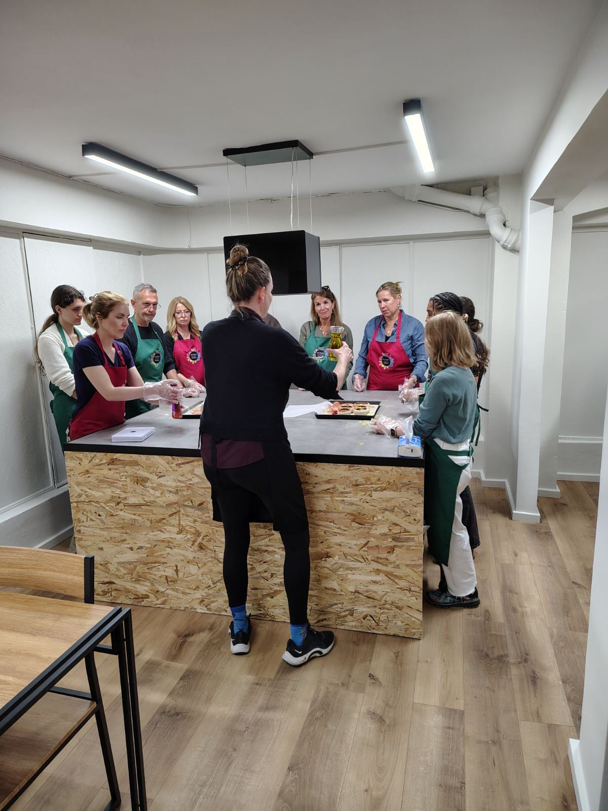 Guests rolling fresh phyllo dough in a Greek cooking class in Athens