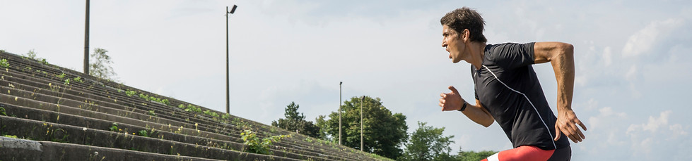 man running up steps