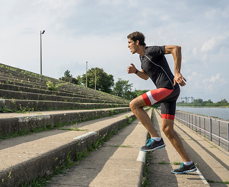 man running up steps
