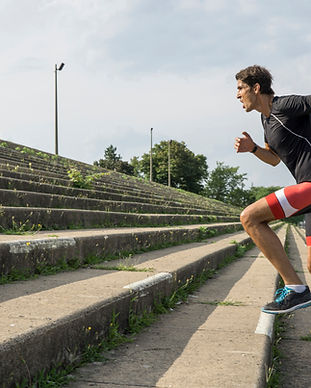 man running up steps
