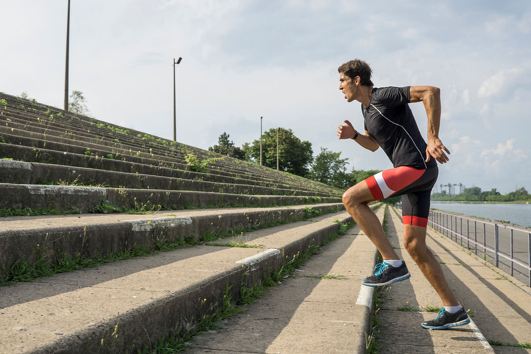 man running up steps
