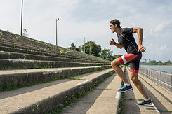 man running up steps