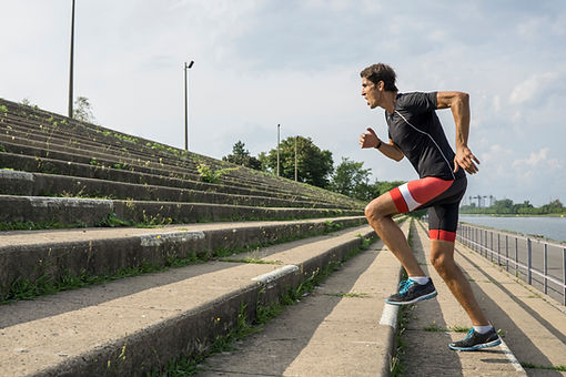 man running up steps