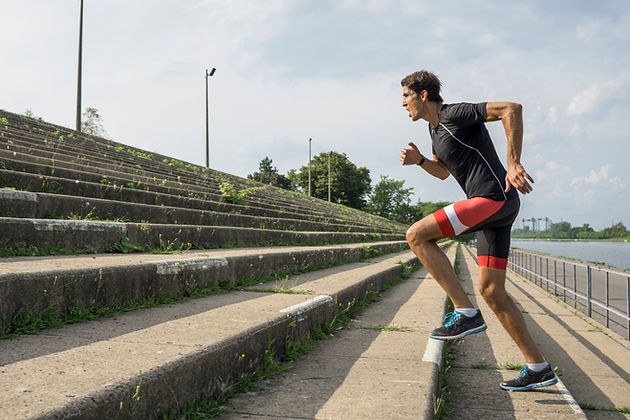 man running up steps