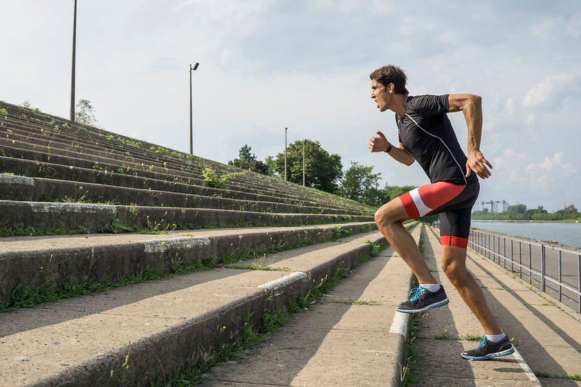 man running up steps