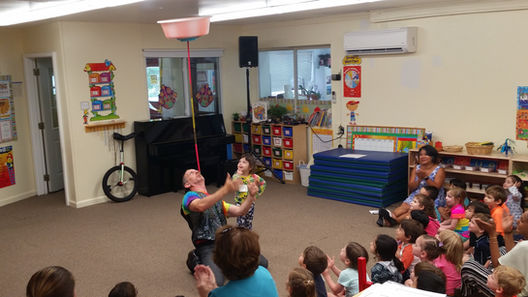 Circus workshops at an educational event, where participants learn circus skills like juggling, balancing, and acrobatics under the guidance of experienced performers