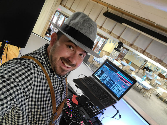 Amidst the vibrant tents and spirited crowds of Oktoberfest, a DJ takes center stage, hosting a lively DJ party. Surrounded by colorful decorations and revelers clad in traditional Bavarian attire, the DJ spins upbeat tunes that energize the atmosphere. With pulsating rhythms and infectious beats, guests raise their beer steins and dance joyously, fully embracing the festive spirit of Oktoberfest. It's a scene of pure celebration and excitement, where music and tradition merge to create unforgettable memories for all who attend.