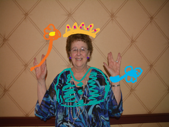 Guest posing with personalized digital drawings created on a Photo Graffiti Wall