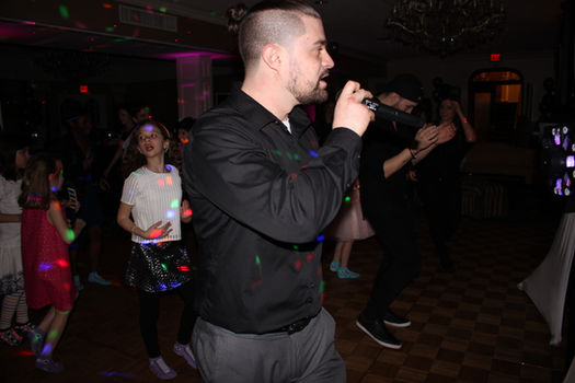 An MC Skillfully Hosting and Guiding the Awards Night with Charisma and Expertise