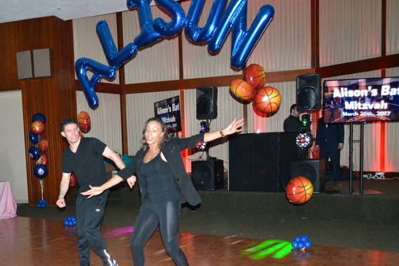 Motivational Dancers Inspiring Energy and Fun at a Formal Family Event