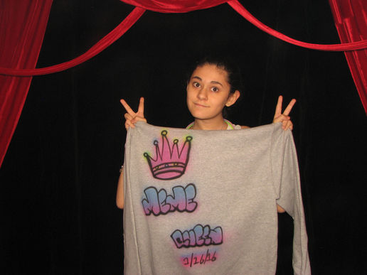 Guest holding a custom airbrushed shirt event party favor