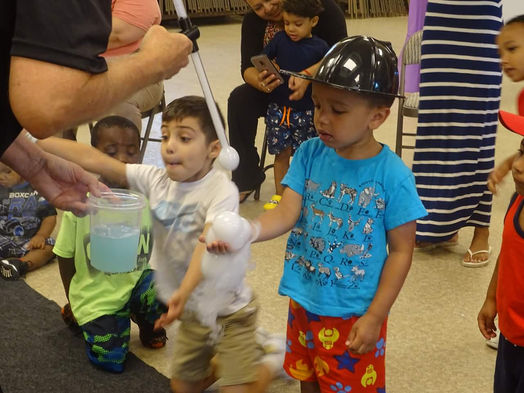 A Bubble Show Captivating Children with Magical Bubbles and Interactive Fun at a Daycare Center