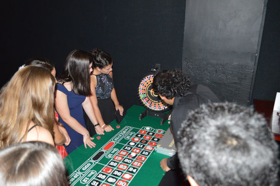 Casino games set up at a charity gala, inviting guests to enjoy a night of fun and fundraising