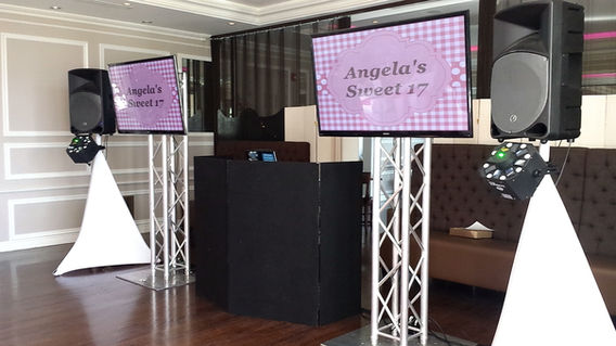 Quinceañera DJ booth with screens and sound system