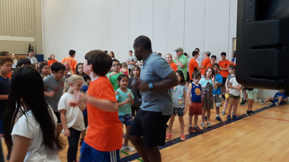 Interactive DJ guiding student participation at event