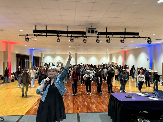 rows of dancers performing country line dance