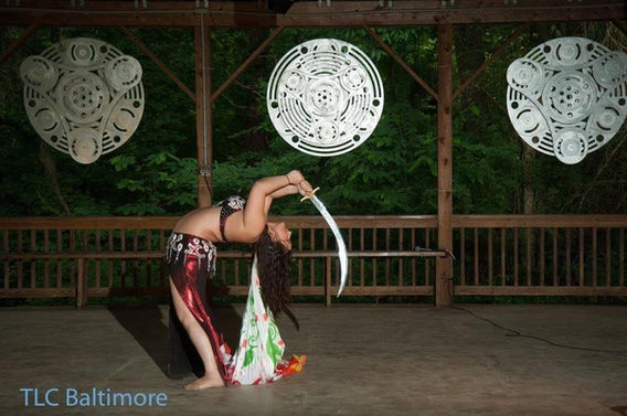 belly dancer using hoop prop