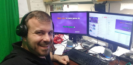 A virtual karaoke session at a corporate event, featuring participants singing along to lyrics displayed on their screens while engaging through video calls