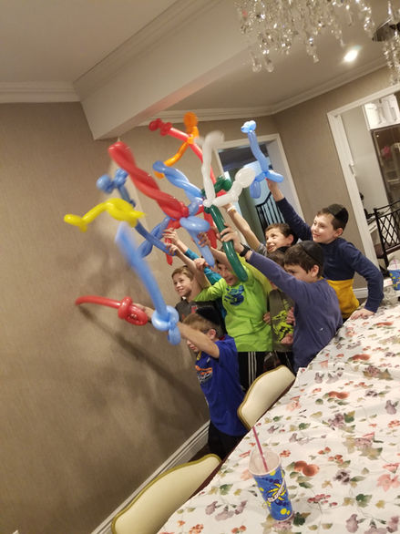 Balloon Twisting Creating Fun and Imaginative Balloon Sculptures for Children at a Daycare Center