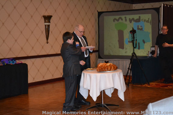 Attendees drawing on an interactive graffiti wall with artwork projected during an event
