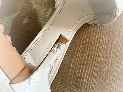 Specialized shoe care add-ons showing protective and corrective heel repair treatments on a luxury white stiletto at Sole Revival Bangkok.