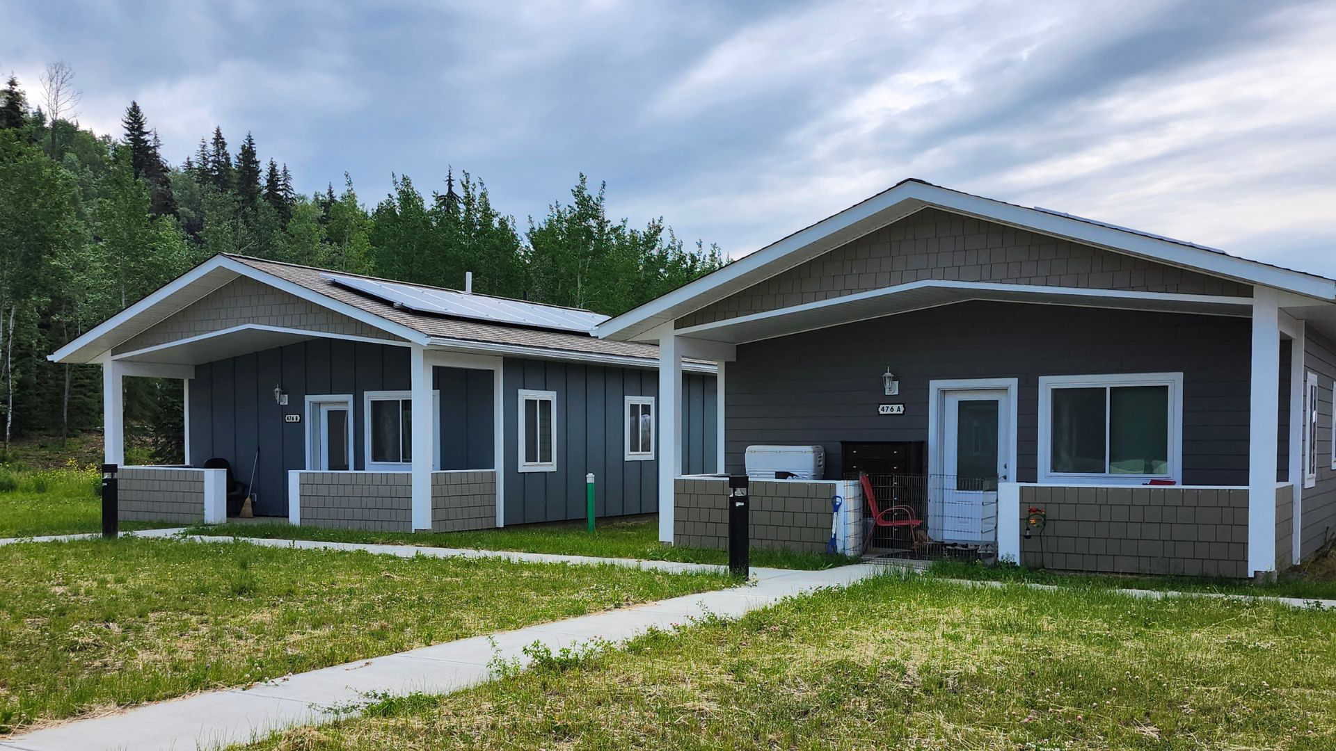 Rooftop solar arrays installed on a dwelling unit at the Nak'azdli Tiny Homes for Elders development, part of a BC Hydro net-metering system in Fort St. James.
