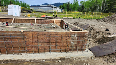 NCL worker on site during foundation wall formwork and rebar installation for the Mass Timber House Pilot Project.