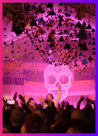 Daylesford Organic Day of the Dead Fiesta DJ set with neon skull backdrop