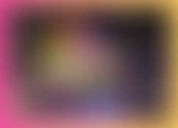 A stunning aerial view of Coal Drops Yard at night, illuminated by thousands of lights. The lights highlight the architectural features of the buildings, with a 45ft Christmas tree standing as a centerpiece.